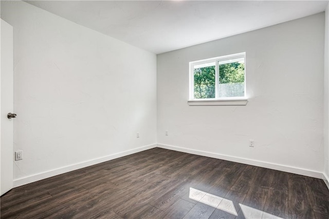 6220 Blarwood Dr, Austin, TX 78745 - unfurnished room with dark wood-style flooring and baseboards