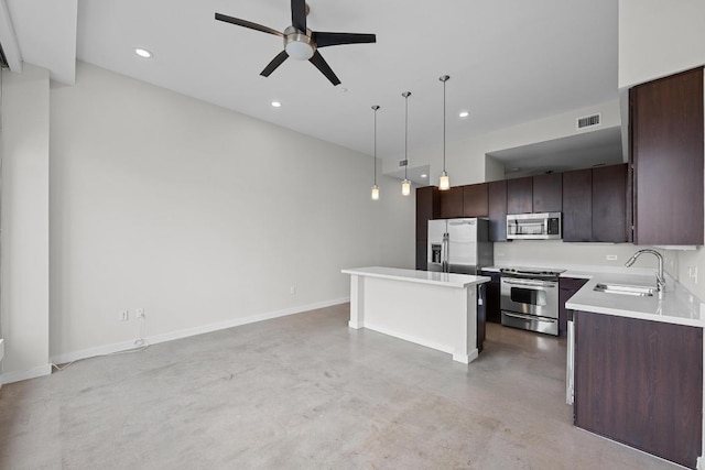 507 Sabine St Unit 503, Austin, TX 78701 - kitchen with a sink, concrete flooring, visible vents, a ceiling fan, and appliances with stainless steel finishes