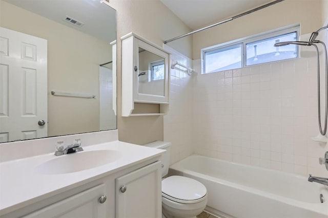 full bathroom with toilet, visible vents,  shower combination, and vanity