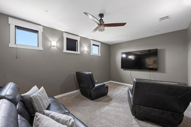 home theater room with carpet flooring, baseboards, a ceiling fan, and visible vents