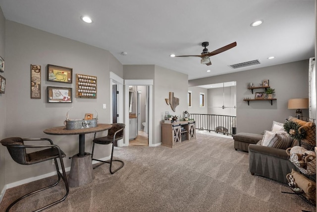 carpeted living area with a ceiling fan, recessed lighting, baseboards, and visible vents