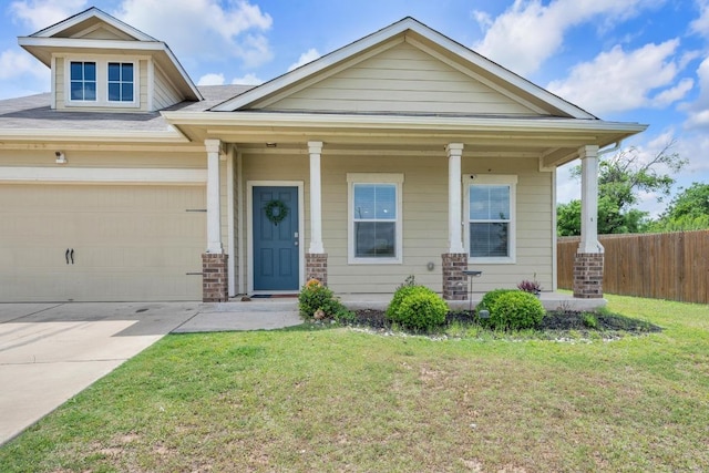 310 Garcitas Creek Ln, Hutto, TX 78634 - craftsman house featuring covered porch, concrete driveway, and a garage