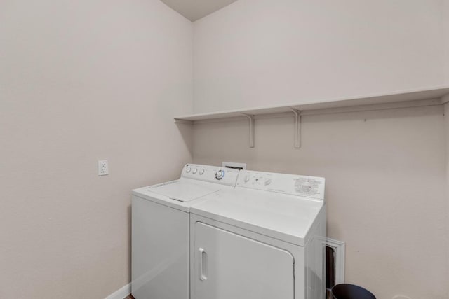 310 Garcitas Creek Ln, Hutto, TX 78634 - laundry room featuring washer and dryer and baseboards