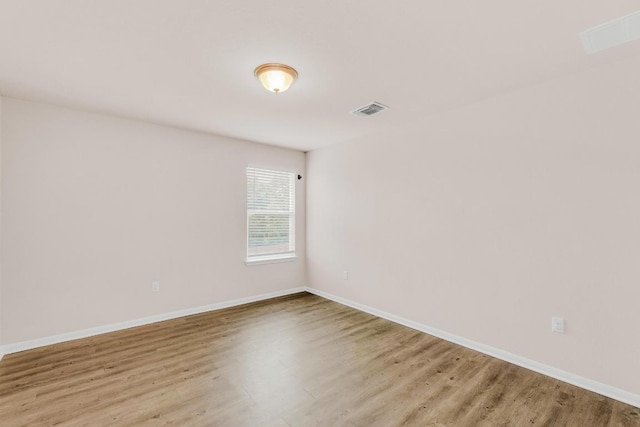 310 Garcitas Creek Ln, Hutto, TX 78634 - spare room with wood finished floors and baseboards