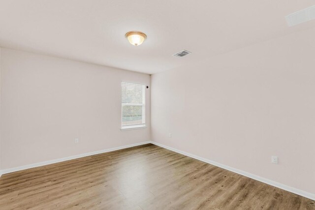 310 Garcitas Creek Ln, Hutto, TX 78634 - empty room featuring wood finished floors and baseboards