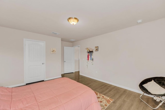 310 Garcitas Creek Ln, Hutto, TX 78634 - bedroom featuring wood finished floors and baseboards