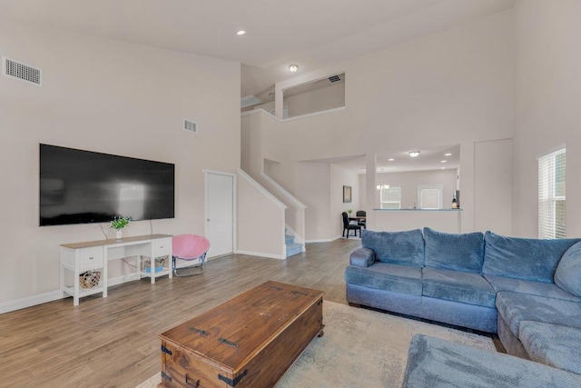 310 Garcitas Creek Ln, Hutto, TX 78634 - living room with stairs, high vaulted ceiling, wood finished floors, baseboards, and recessed lighting