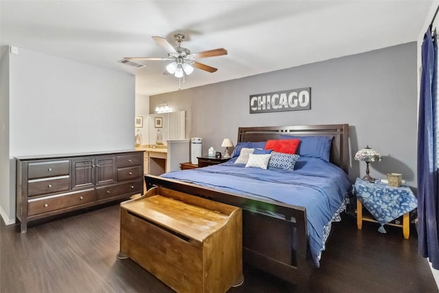 1610 Old Tract Rd, Pflugerville, TX 78660 - bedroom featuring dark wood-style flooring, a ceiling fan, and connected bathroom