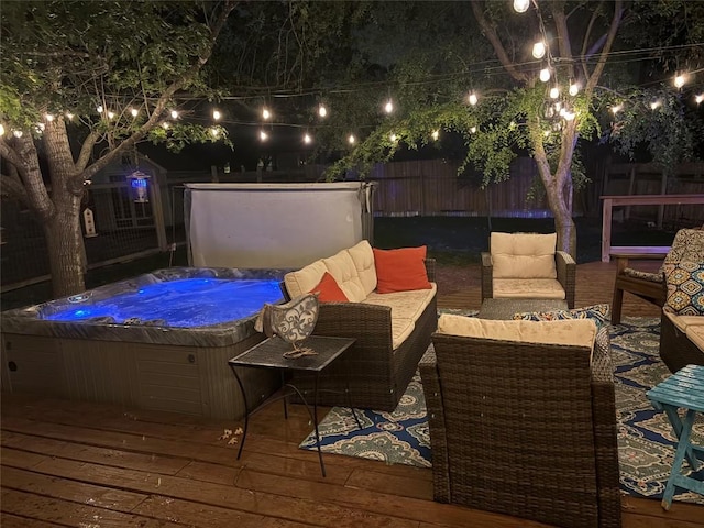 1610 Old Tract Rd, Pflugerville, TX 78660 - deck at twilight featuring a hot tub, a fenced backyard, and an outdoor hangout area