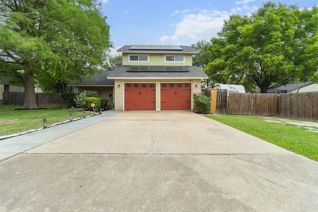 1610 Old Tract Rd, Pflugerville, TX 78660 - traditional home featuring solar panels, concrete driveway, and an attached garage