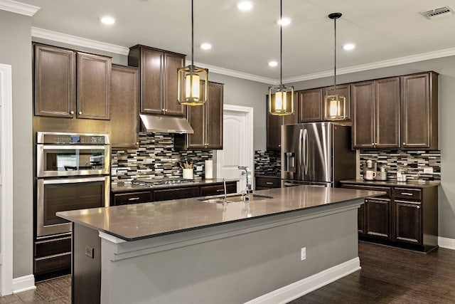 404 Buttercup Creek Blvd Unit 11, Cedar Park, TX 78613 - kitchen with stainless steel appliances, a sink, dark countertops, under cabinet range hood, and dark brown cabinetry