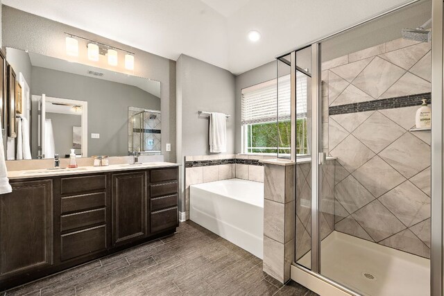 404 Buttercup Creek Blvd Unit 11, Cedar Park, TX 78613 - bathroom featuring a shower stall, a garden tub, double vanity, and recessed lighting