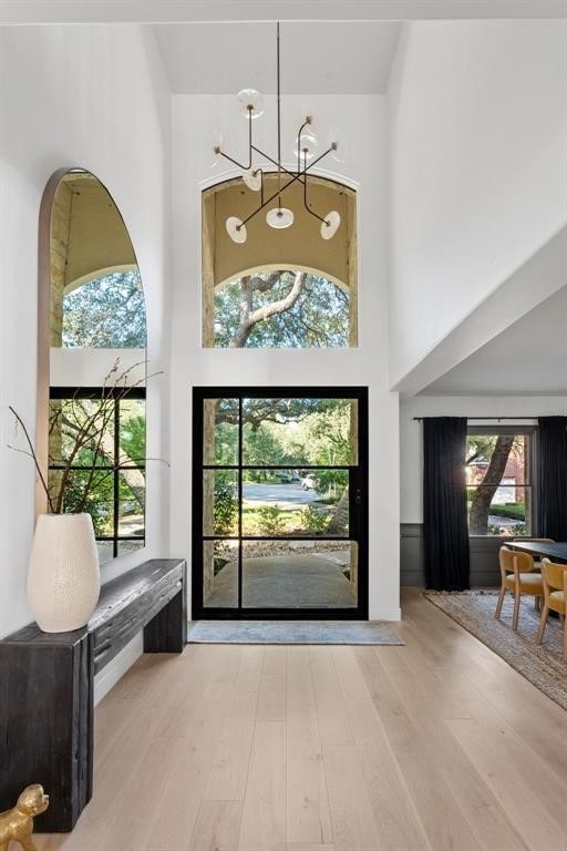 2901 Meandering River Ct, Austin, TX 78746 - entryway featuring a high ceiling and wood finished floors