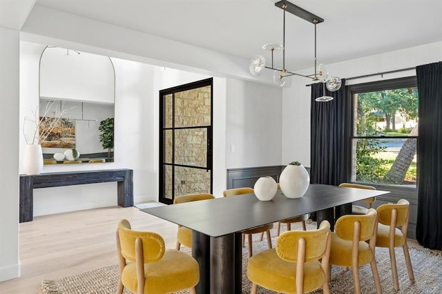 2901 Meandering River Ct, Austin, TX 78746 - dining room with wood finished floors and a chandelier