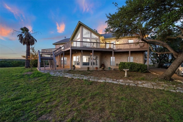 2400 W Fitzhugh Rd, Dripping Springs, TX 78630 - rear view of house featuring a wooden deck, stairs, a yard, and stone siding