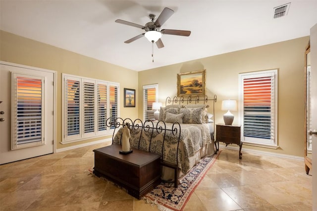 2400 W Fitzhugh Rd, Dripping Springs, TX 78630 - tiled bedroom with baseboards and ceiling fan