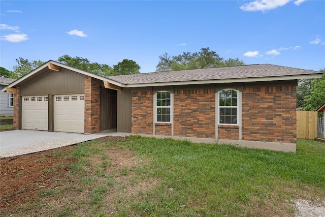ranch-style home with a garage, fence, concrete driveway, a shingled roof, and a front yard