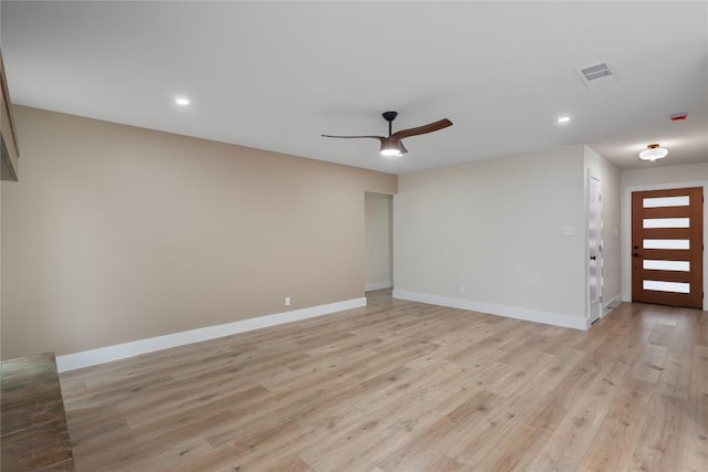 interior space featuring light wood-style floors, baseboards, a ceiling fan, and recessed lighting
