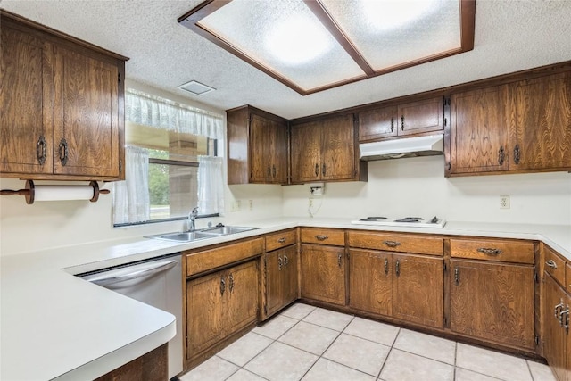 13505 Broadmeade Ave, Austin, TX 78729 - kitchen with under cabinet range hood, dishwashing machine, a textured ceiling, light countertops, and light tile patterned floors