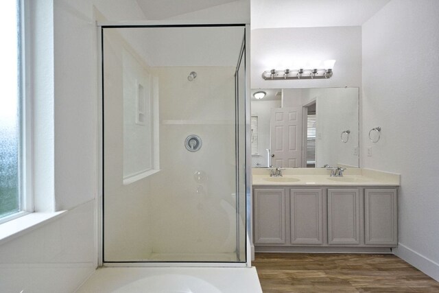 2539 Fayette Dr, New Braunfels, TX 78130 - full bath with a stall shower, double vanity, wood finished floors, and baseboards