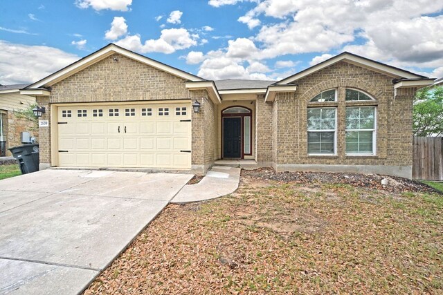 2539 Fayette Dr, New Braunfels, TX 78130 - single story home with brick siding, driveway, an attached garage, and fence