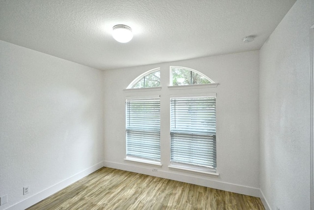 2539 Fayette Dr, New Braunfels, TX 78130 - spare room with baseboards, wood finished floors, and a textured ceiling