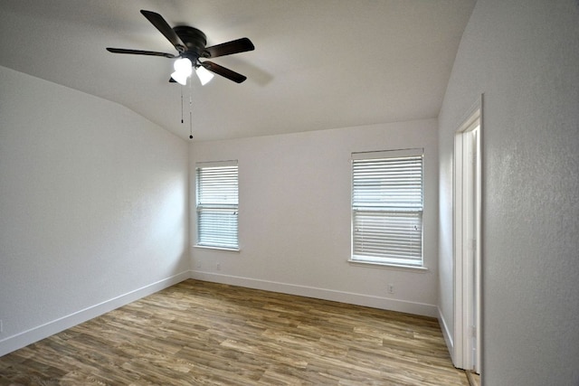 2539 Fayette Dr, New Braunfels, TX 78130 - unfurnished room with vaulted ceiling, wood finished floors, ceiling fan, and baseboards