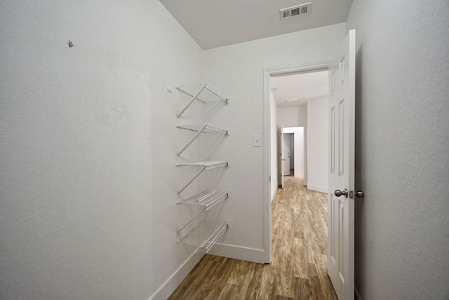 2539 Fayette Dr, New Braunfels, TX 78130 - spacious closet featuring wood finished floors