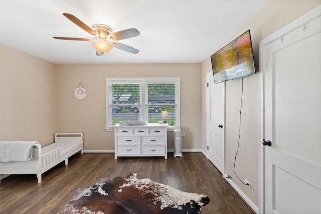 bedroom with baseboards, dark wood-style flooring, and ceiling fan
