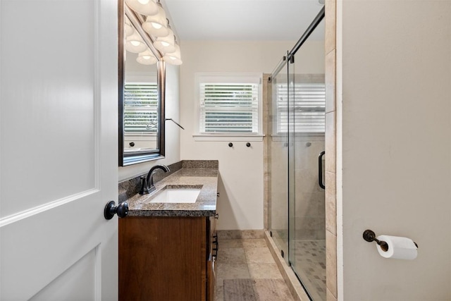 bathroom with vanity and a stall shower