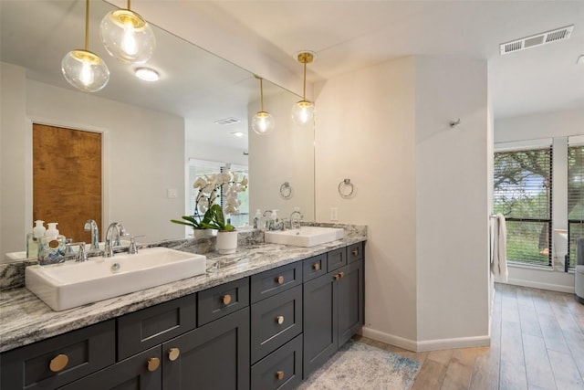 113 Comet, Lakeway, TX 78734 - full bathroom with visible vents, wood finished floors, and a sink
