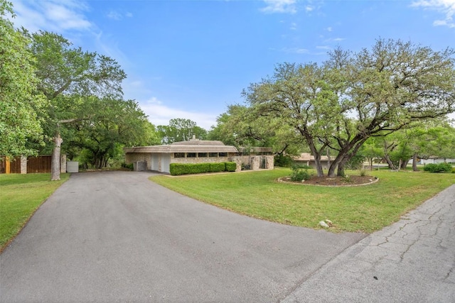 113 Comet, Lakeway, TX 78734 - ranch-style house featuring a front lawn, driveway, and a garage