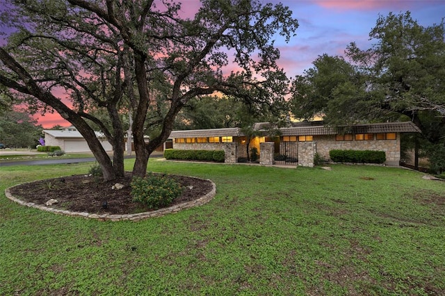 113 Comet, Lakeway, TX 78734 - view of front of house with stone siding and a front lawn