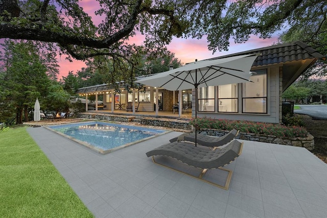 113 Comet, Lakeway, TX 78734 - pool at dusk with a patio area and an outdoor pool