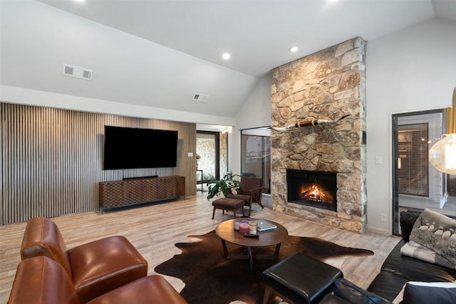 113 Comet, Lakeway, TX 78734 - living room featuring visible vents, wood finished floors, a fireplace, and high vaulted ceiling
