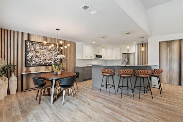 113 Comet, Lakeway, TX 78734 - dining room with a chandelier, recessed lighting, visible vents, and light wood-style floors