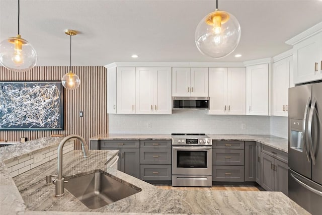 113 Comet, Lakeway, TX 78734 - kitchen with a sink, stainless steel appliances, gray cabinets, and white cabinets