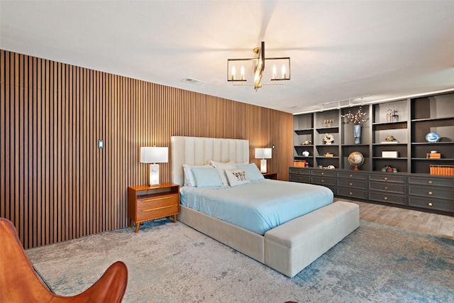 113 Comet, Lakeway, TX 78734 - bedroom featuring a chandelier and wood finished floors