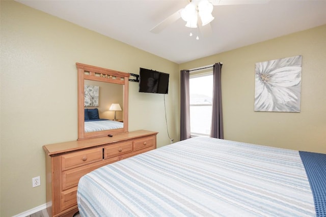 bedroom with baseboards and ceiling fan