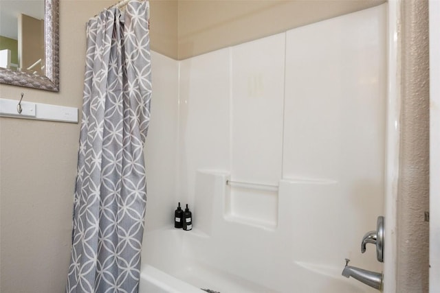 bathroom featuring shower / bath combination with curtain