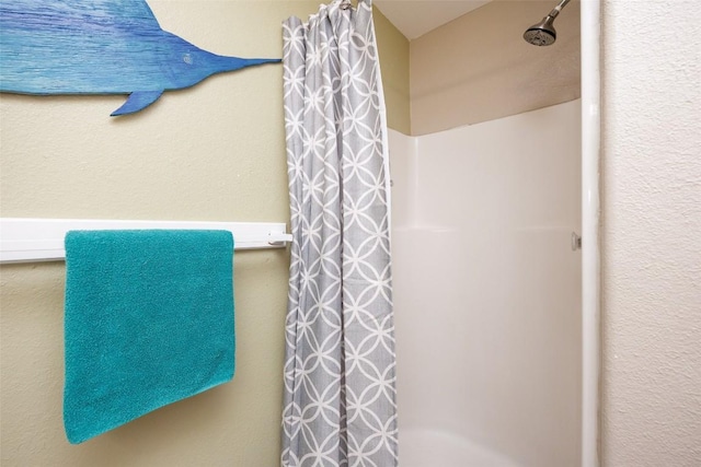 bathroom featuring curtained shower