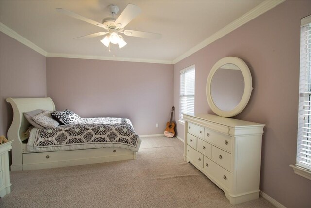 bedroom with light carpet, baseboards, a ceiling fan, and ornamental molding