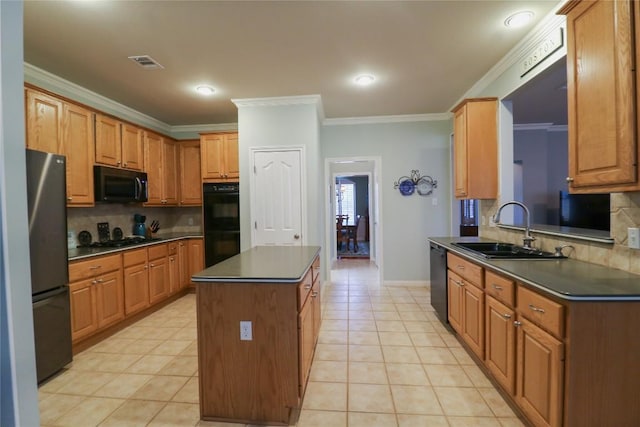 kitchen with a sink, dark countertops, visible vents, black appliances, and ornamental molding