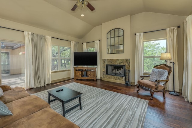 600 Mountain Dew Rd, Horseshoe Bay, TX 78657 - living area with lofted ceiling, baseboards, ceiling fan, a high end fireplace, and wood finished floors