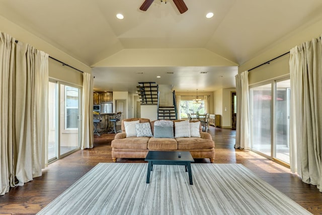 600 Mountain Dew Rd, Horseshoe Bay, TX 78657 - living room featuring lofted ceiling, ceiling fan with notable chandelier, a healthy amount of sunlight, and stairs