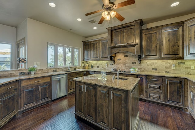 600 Mountain Dew Rd, Horseshoe Bay, TX 78657 - kitchen featuring light stone countertops, recessed lighting, stainless steel dishwasher, visible vents, and a sink