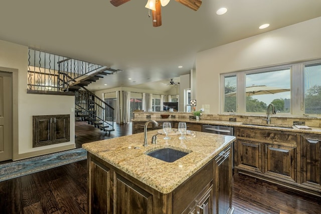 600 Mountain Dew Rd, Horseshoe Bay, TX 78657 - kitchen with a ceiling fan, a sink, and dark wood-type flooring