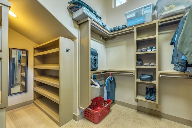 600 Mountain Dew Rd, Horseshoe Bay, TX 78657 - walk in closet featuring vaulted ceiling and carpet