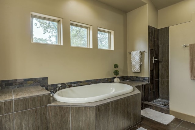 600 Mountain Dew Rd, Horseshoe Bay, TX 78657 - bathroom featuring a garden tub, tiled shower, and tile patterned floors
