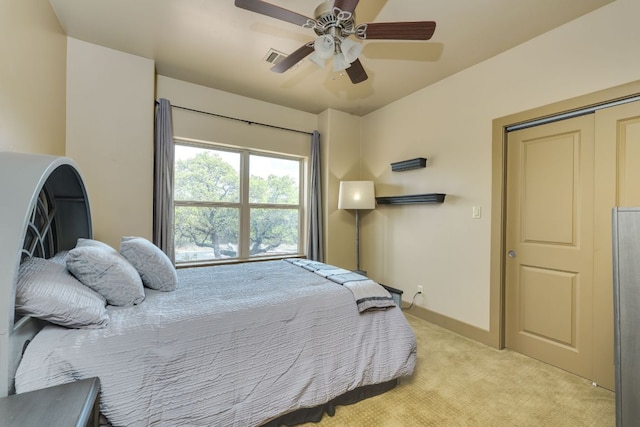 600 Mountain Dew Rd, Horseshoe Bay, TX 78657 - bedroom featuring light colored carpet, visible vents, baseboards, and ceiling fan